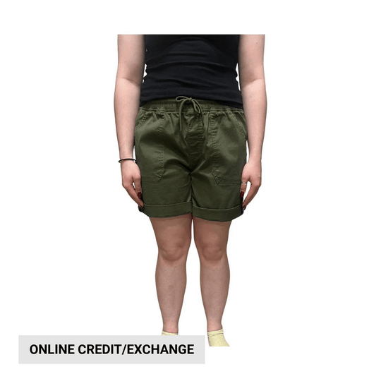 Olive drawstring cargo shorts worn with a black tank top