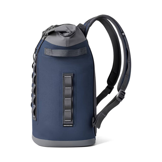 Navy backpack cooler with gray roll-top, front webbing loops, and padded straps