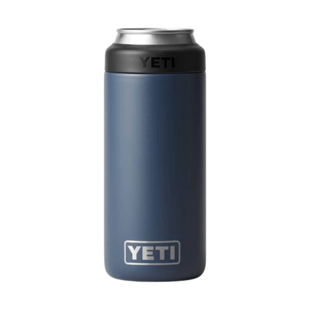 Tall navy insulated can holder with a black top, silver rim, and YETI logos