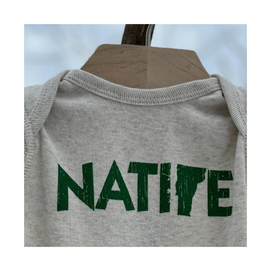 Light gray infant onesie with green NATPE print on the front