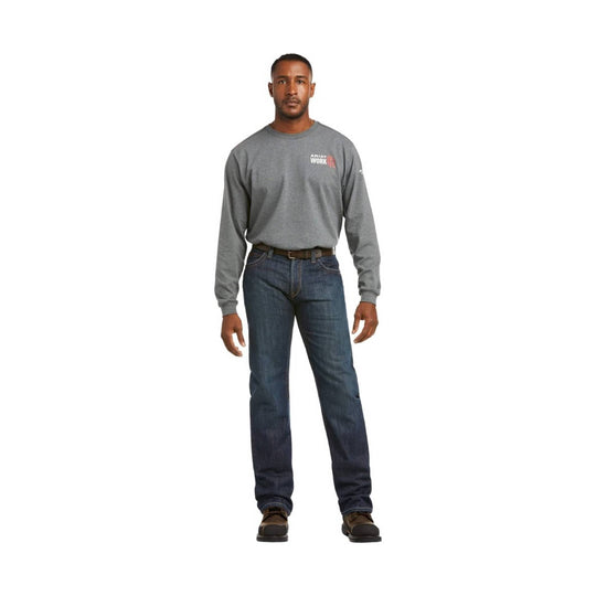 Man wearing a gray long-sleeve shirt and dark boot-cut jeans with work shoes