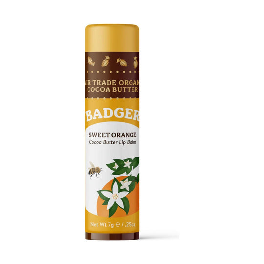 Orange and brown lip balm tube with floral artwork and a bee