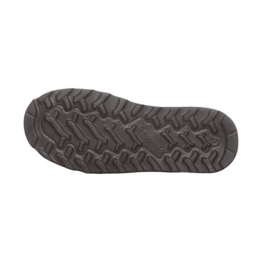 Dark brown boot outsole with deep tread pattern
