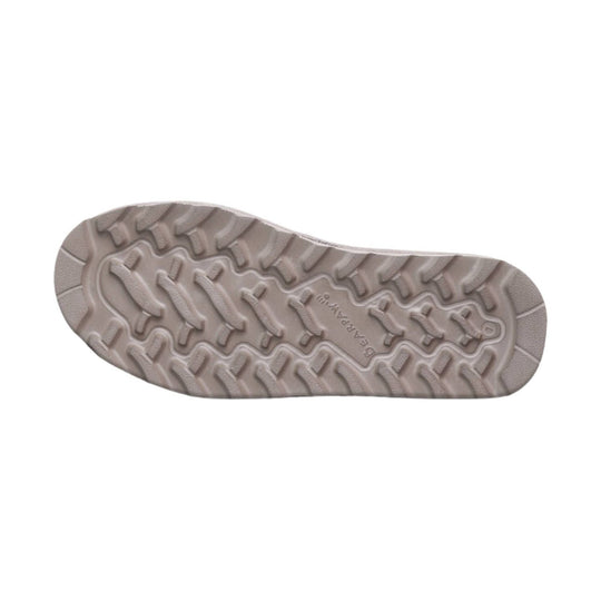 Light taupe boot sole with rugged tread and BEARPAW branding