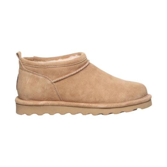 Tan suede ankle boot with shearling lining, pull tab, and thick ridged sole