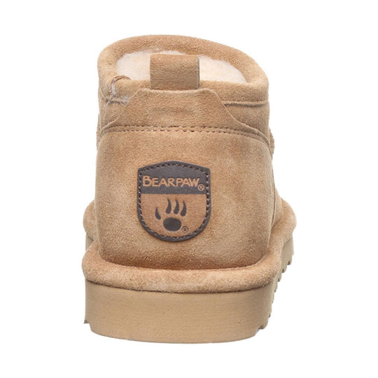 Tan suede ankle boot seen from the back with a logo patch, fleece lining, and a thick sole