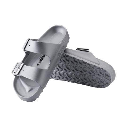 Metallic silver two-strap slip-on sandal with buckles and contoured footbed