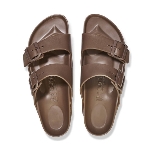 Brown two-strap sandals with buckles and contoured footbeds, shown top view