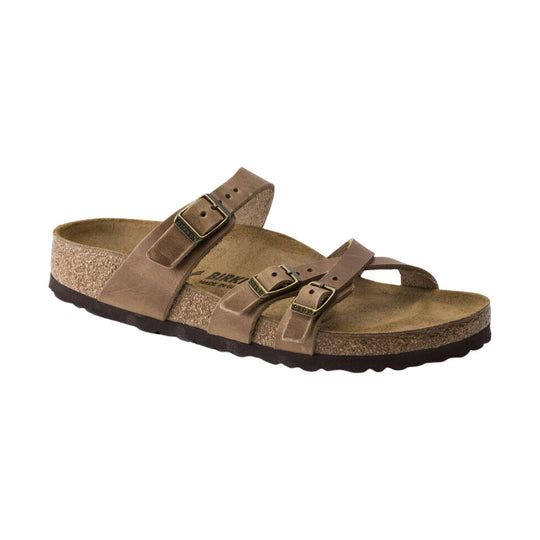 Brown leather sandal with thin crisscross straps and a cork footbed