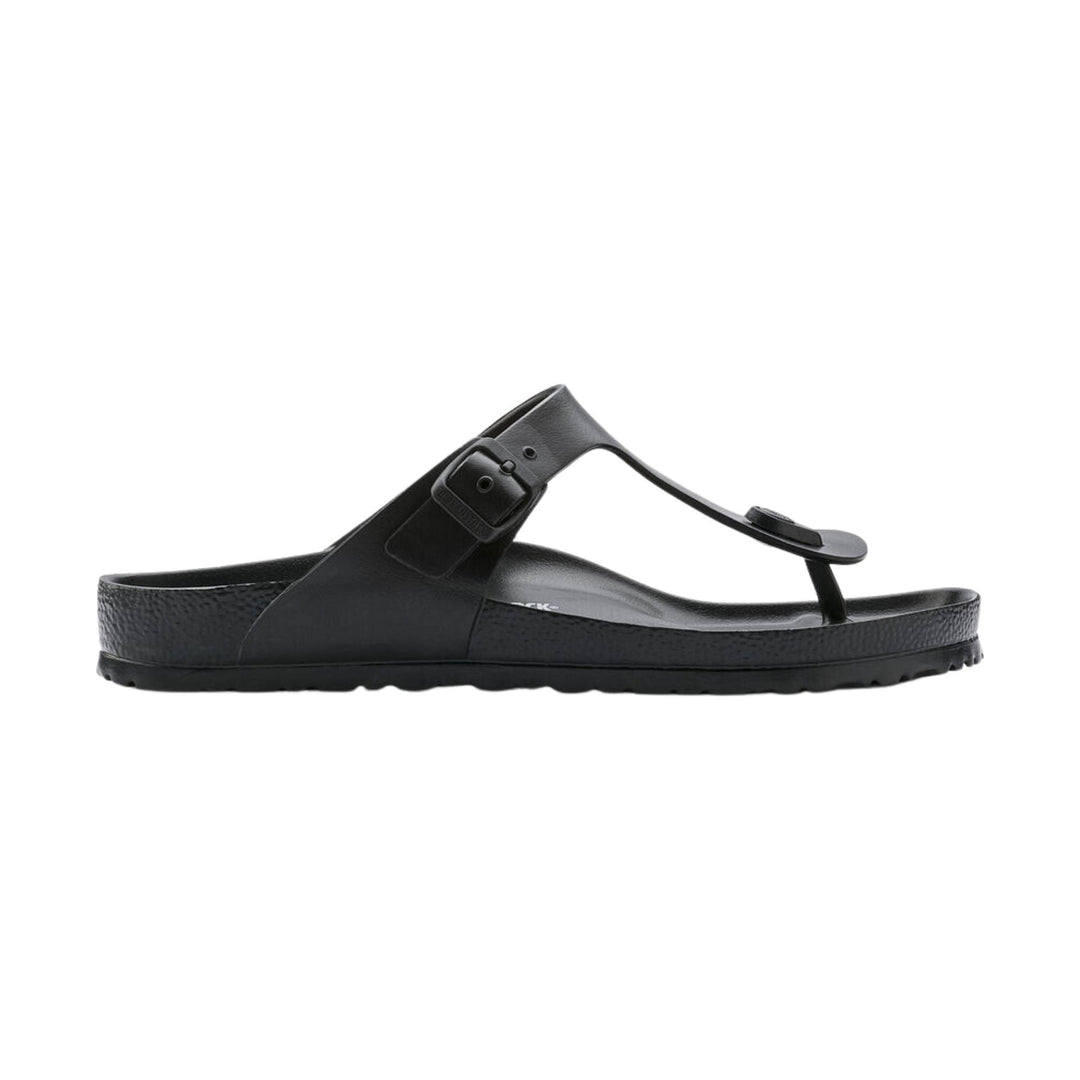 Black thong-style sandal with a buckle strap and contoured footbed, side view