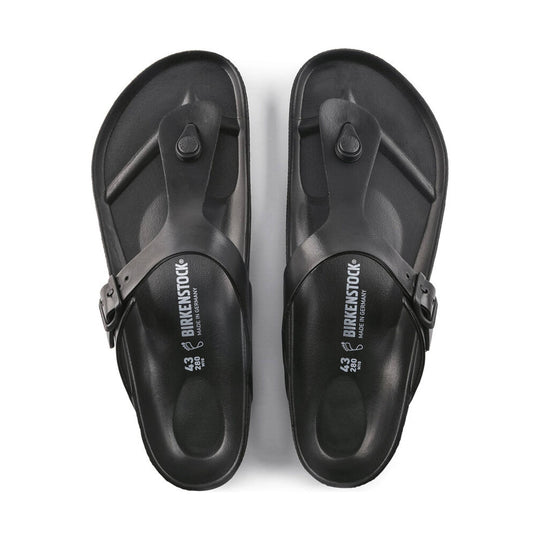 Pair of black thong sandals with buckle straps and molded footbeds, shown from above