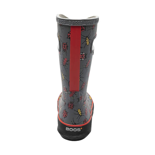 Gray pull-on rain boot with bug print, red center stripe, and black sole