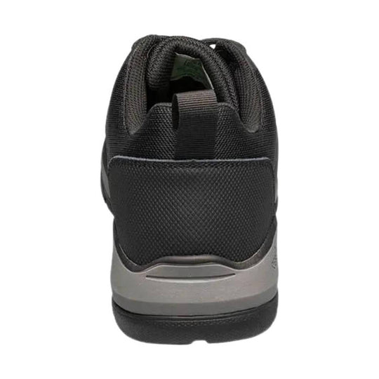 Black low-top work shoe seen from the back with a gray midsole and textured mesh upper