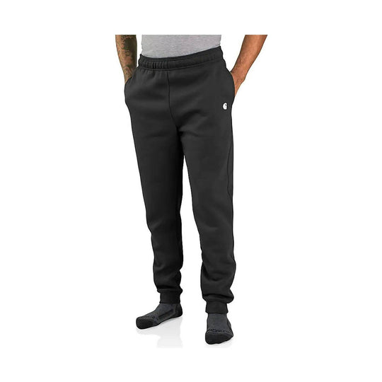 Black tapered sweatpants with elastic waistband and ankle cuffs, worn with dark socks