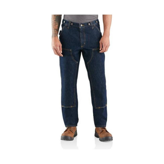 Dark blue work jeans with reinforced knees, front utility pockets, and brown work boots visible