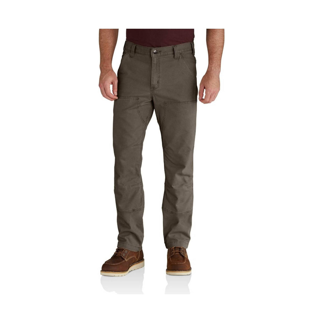 Olive work pants with reinforced knees, front pockets, and brown work boots