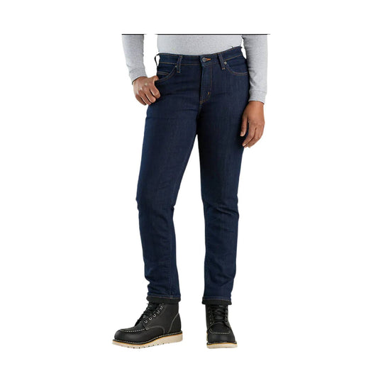 Dark wash slim straight jeans with a relaxed fit, shown with a light gray top and black work boots