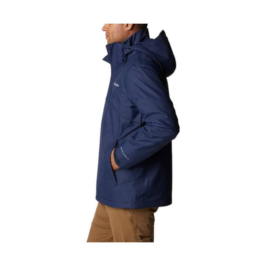 Navy hooded zip-up jacket with side pockets, shown in profile
