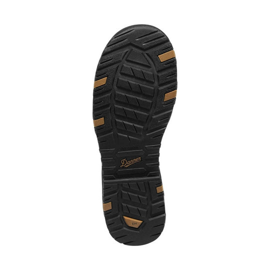 Black boot outsole with rugged tread and tan traction inserts