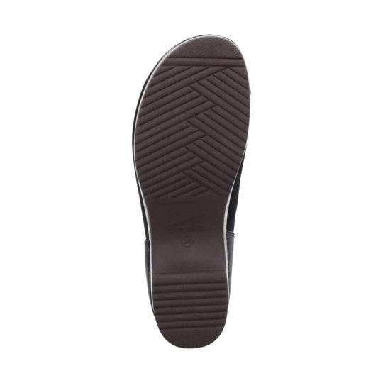 Dark brown shoe sole with chevron tread pattern