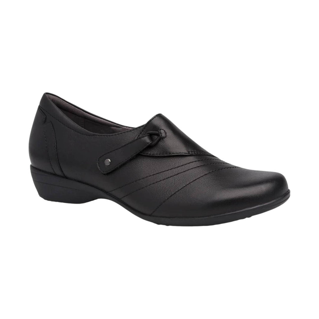Black closed-toe leather shoe with a low wedge heel and decorative side strap