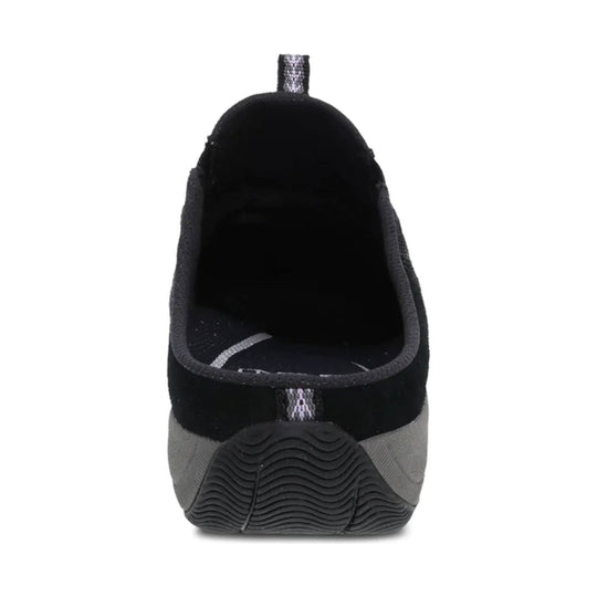 Black slip-on shoe shown from the heel with a textured rubber outsole and pull tab