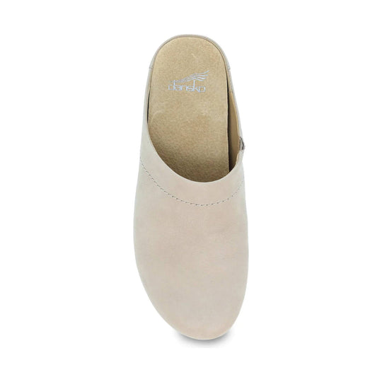 Cream closed-toe slip-on clog with a tan footbed and visible stitched seam