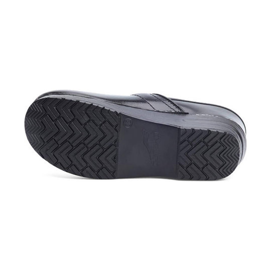 Black clog shown from below, with textured tread sole and embossed Dansko branding.