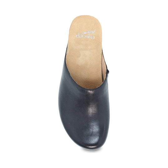 Black open-back clog with a tan insole and visible Dansko logo
