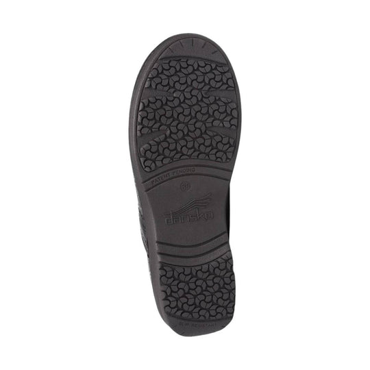 Black slip-resistant shoe outsole with textured tread and Dansko branding