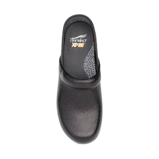 Black embossed clog with a closed toe, open heel, and cushioned footbed labeled Dansko XP 20.