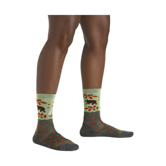 Light green and dark gray crew socks with orange leaf and bear patterns