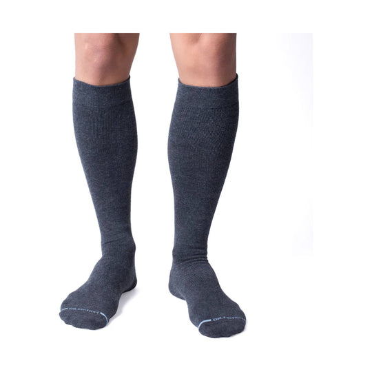 Pair of dark gray knee-high socks with a ribbed knit and visible Dr. Motion branding on the toes