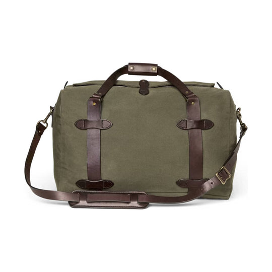 Olive canvas duffel bag with brown leather straps and shoulder strap