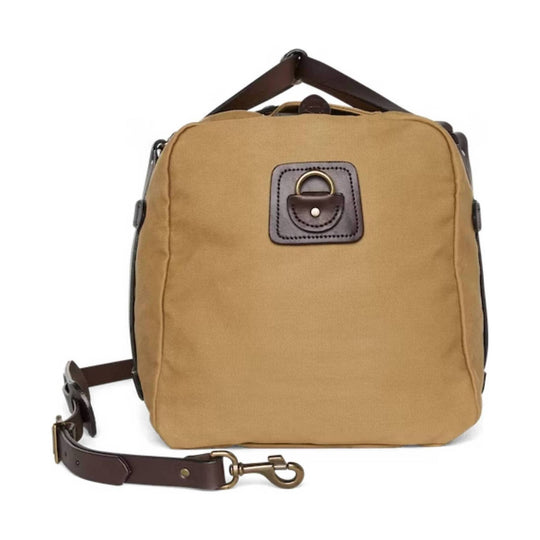 Tan canvas duffel bag with brown leather trim and a detachable shoulder strap