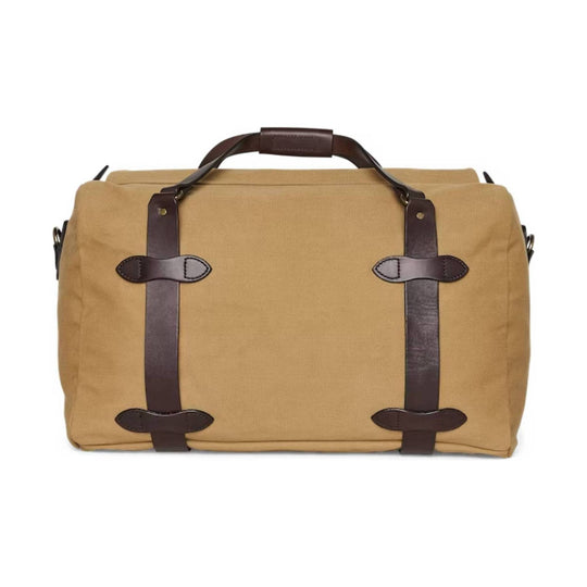 Tan canvas duffel bag with dark leather straps and top handle