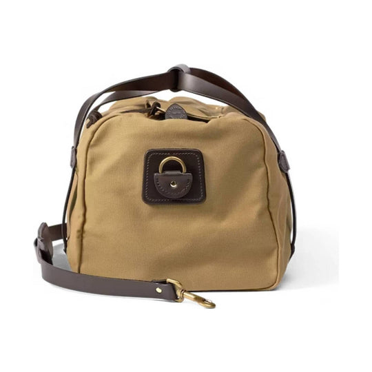 Tan canvas duffel bag with brown leather trim, top handles, and a detachable shoulder strap
