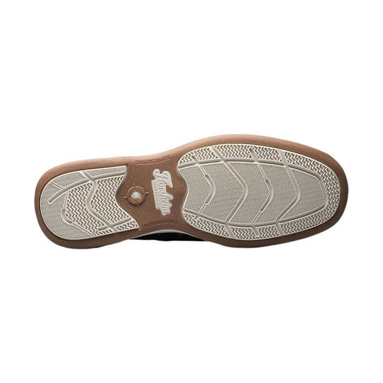 Brown shoe outsole with white herringbone tread and Florsheim branding at the center