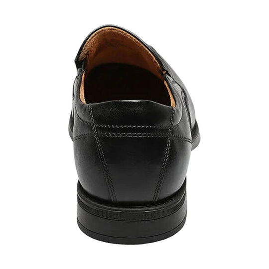 Black leather slip-on dress shoe shown from the back with stitched heel panel and tan interior lining