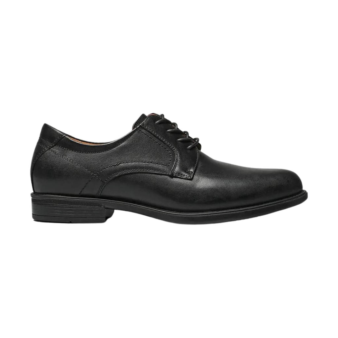 Black leather oxford shoe with lace-up closure and low heel