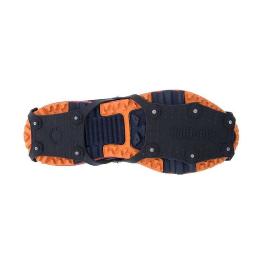 Traction cleats with black straps and orange tread, shown from the sole side