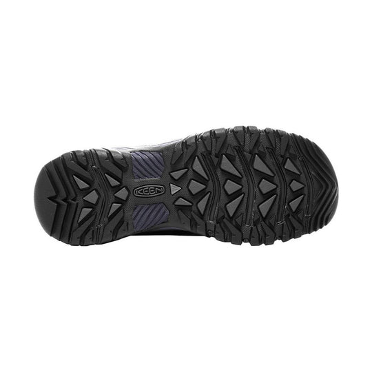 Black lugged boot outsole with KEEN logo and dark purple traction inserts