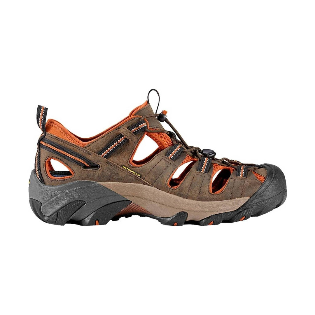 Brown and orange closed-toe hiking sandal with side cutouts, bungee laces, and rugged black sole