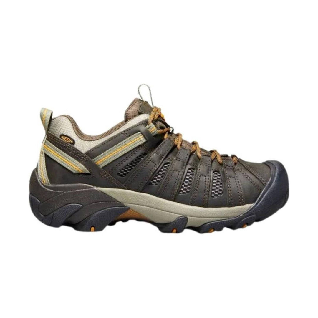 Brown and black closed-toe hiking shoe with mesh side panels, bungee laces, and rugged sole