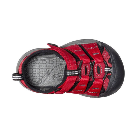 Red and black toddler hiking sandal with closed toe, hook-and-loop straps, and elastic laces