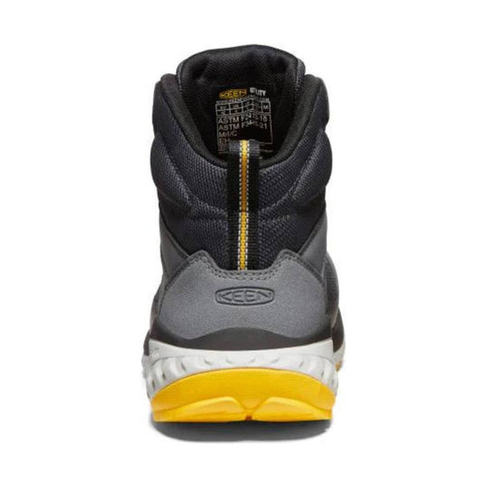 Gray and black mid-height work boot with yellow sole, rear view