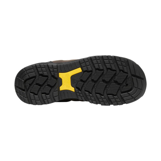 Black rugged boot outsole with deep tread and a yellow KEEN logo insert
