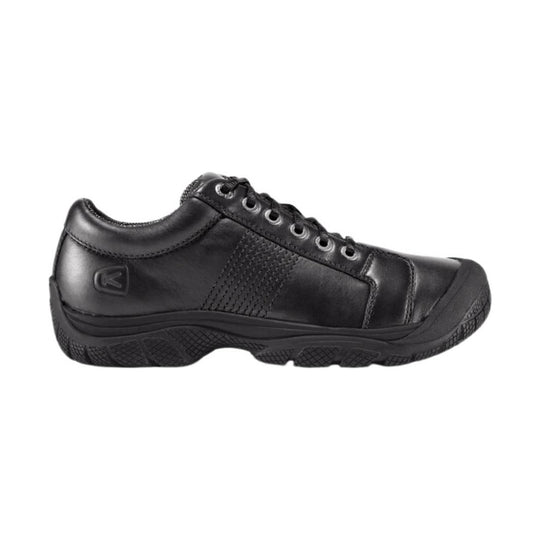 Black leather oxford-style work shoe with lace-up front and thick treaded sole