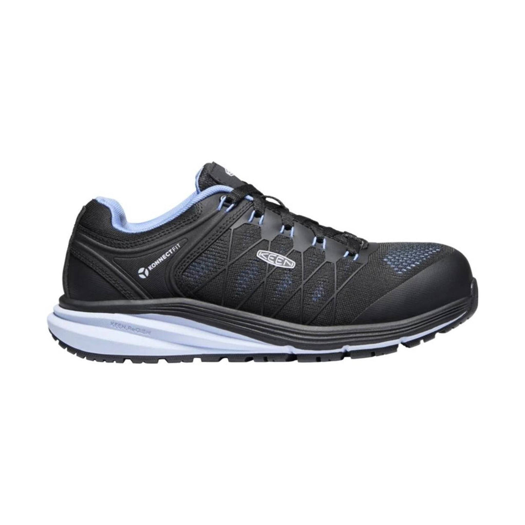 Black low-top work shoe with blue lining, bungee-style laces, and a thick cushioned sole