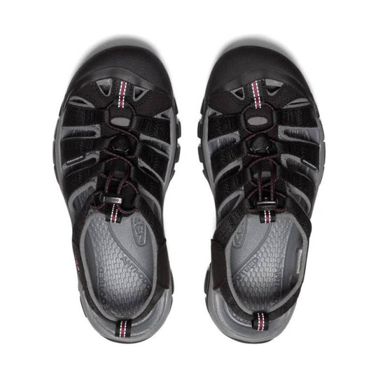 Black and gray closed-toe hiking sandals with bungee laces and red striped pull tabs